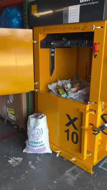 The ReCollective vertical baler with a Crinkly Packaging collection bag