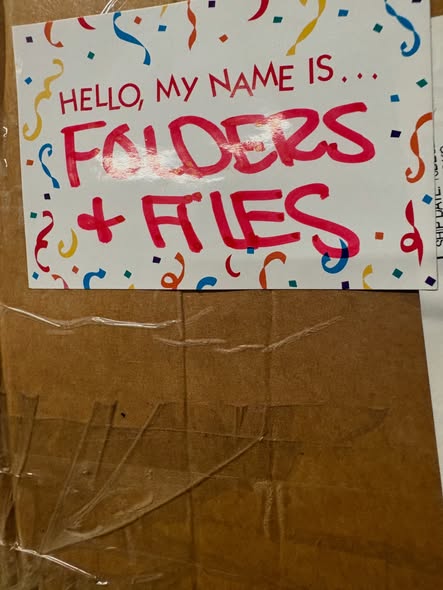 Handwritten warehouse sign reading Hello, my name is Folders and Files
