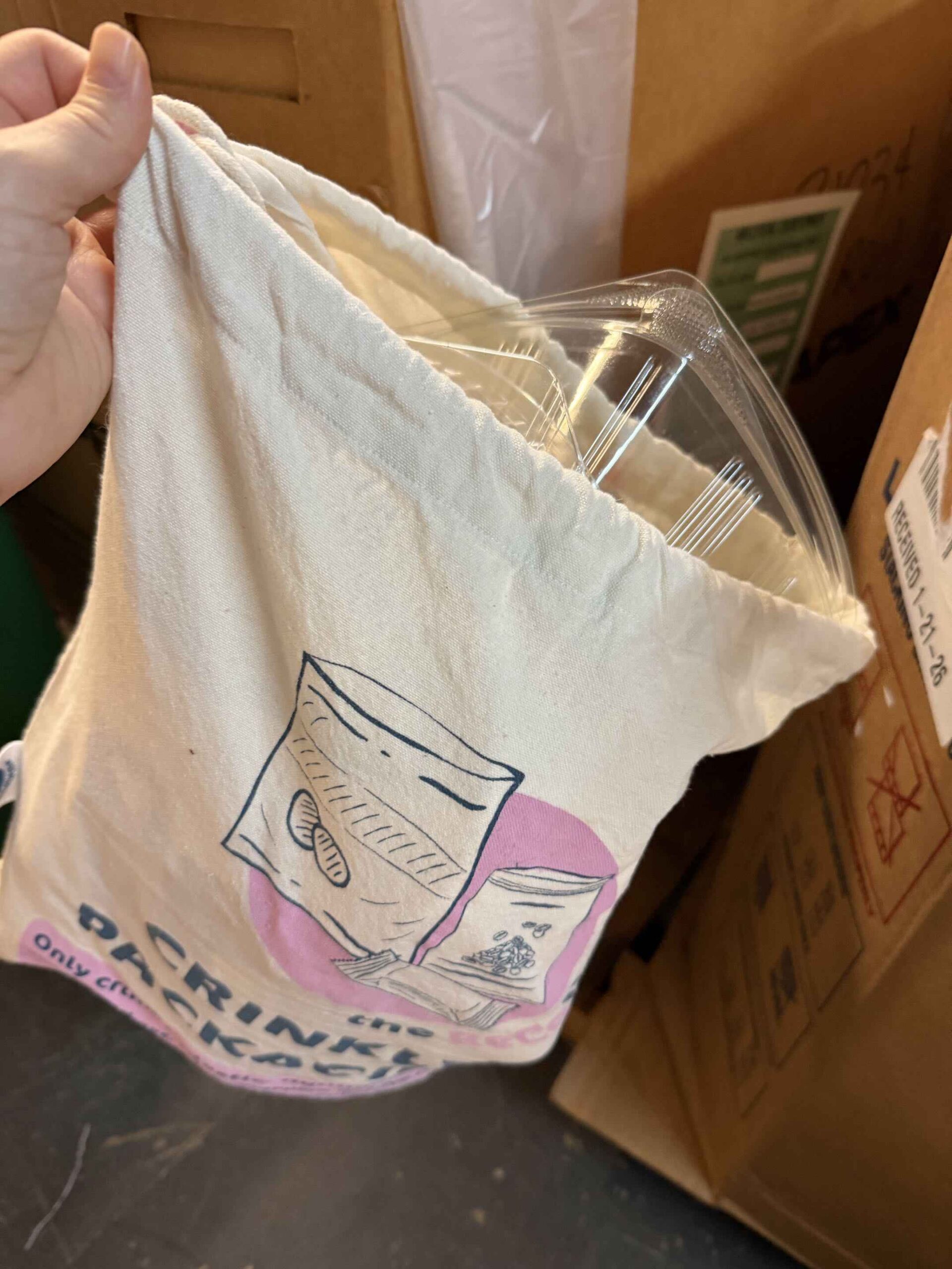 A clear rigid clamshell mistakenly placed in a pink Crinkly Packaging bag during sorting